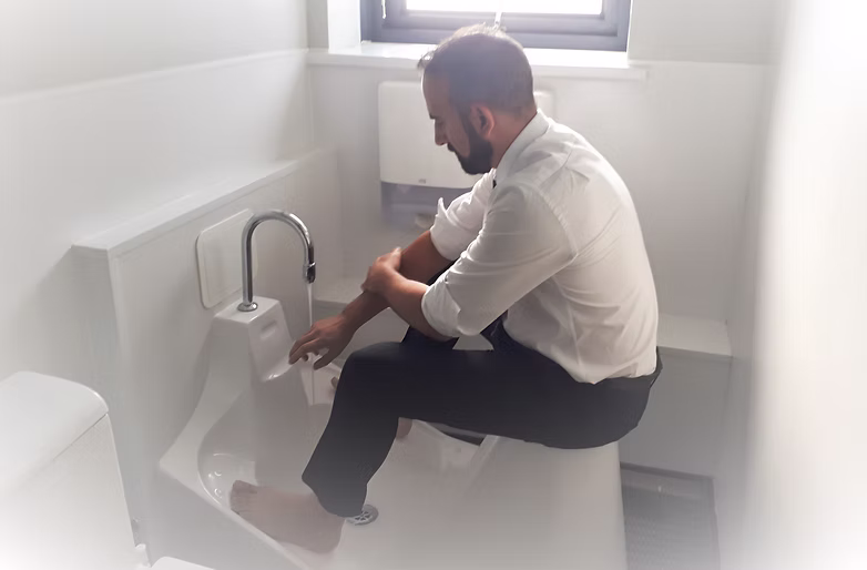 Person performing wudu (ablution)